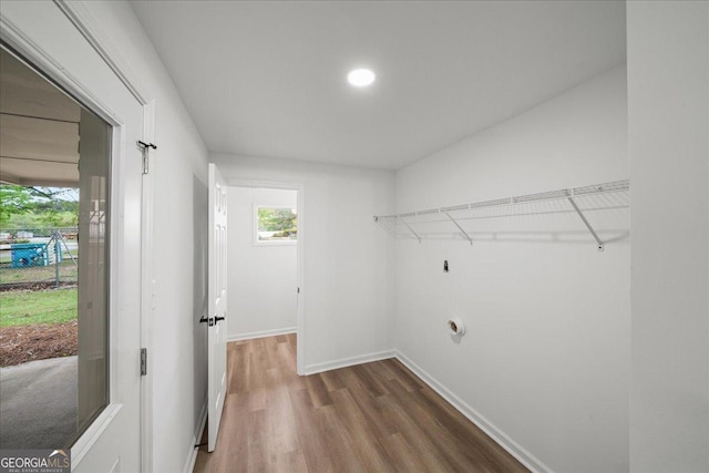 3951 Covered Bridge Rd SW, Smyrna, GA 30082 - laundry area featuring wood finished floors and baseboards