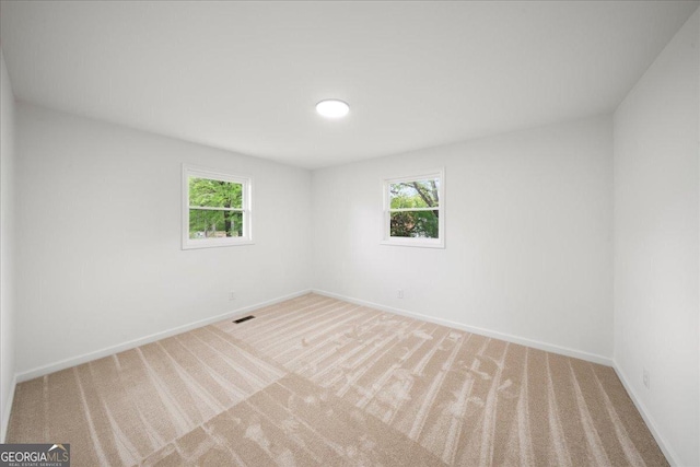 3951 Covered Bridge Rd SW, Smyrna, GA 30082 - carpeted empty room with plenty of natural light and baseboards
