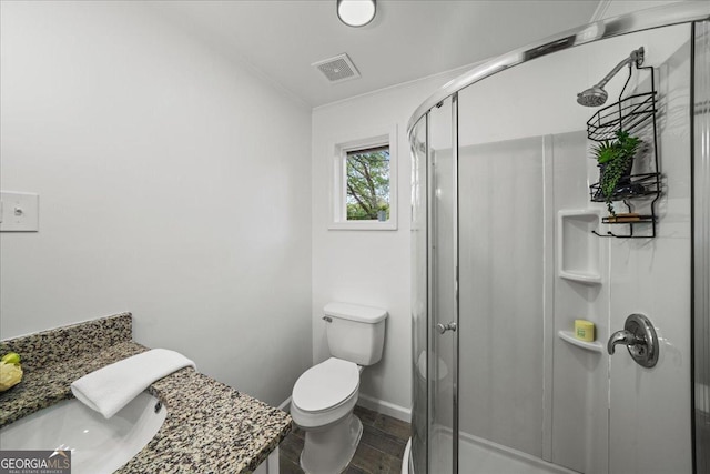 3951 Covered Bridge Rd SW, Smyrna, GA 30082 - bathroom featuring ornamental molding, wood finished floors, a shower stall, toilet, and vanity