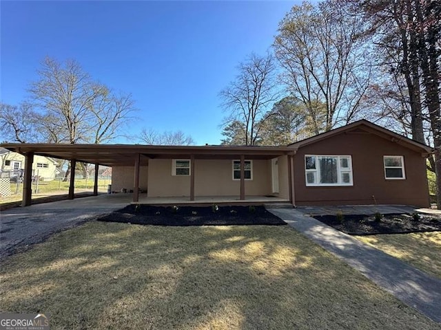 3951 Covered Bridge Rd SW, Smyrna, GA 30082 - single story home with driveway, a carport, and a porch