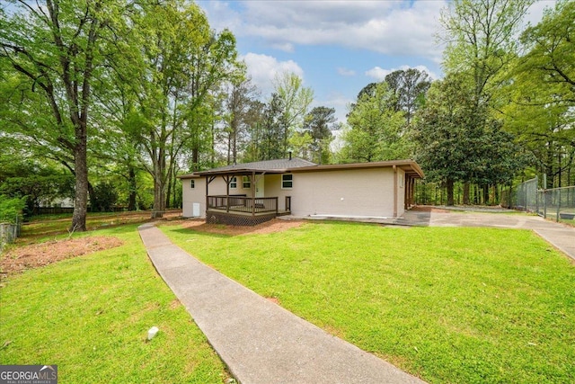 3951 Covered Bridge Rd SW, Smyrna, GA 30082 - view of front of home with driveway, a porch, and view of scattered trees