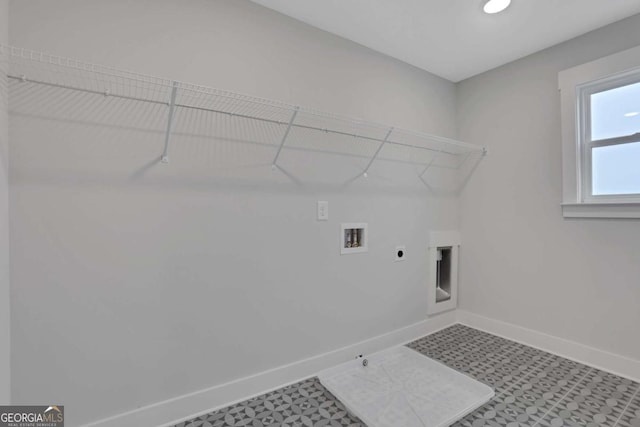 laundry room with gas dryer hookup, hookup for a washing machine, baseboards, laundry area, and hookup for an electric dryer