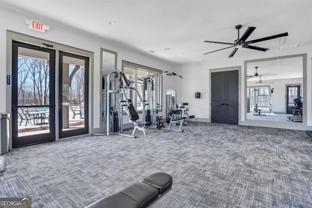 exercise room featuring carpet floors, visible vents, french doors, and a ceiling fan