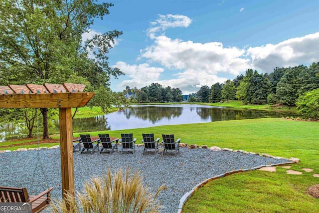 exterior space featuring a water view and a pergola