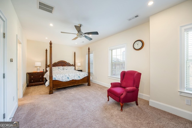 carpeted bedroom featuring a ceiling fan, recessed lighting, baseboards, and visible vents