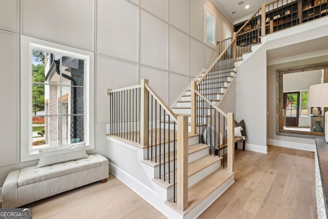 2587 Apple Valley Rd, Brookhaven, GA 30319 - stairway with wood finished floors, crown molding, and recessed lighting