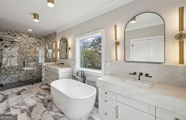 2587 Apple Valley Rd, Brookhaven, GA 30319 - bathroom featuring tiled shower, two vanities, a soaking tub, tile walls, and ornamental molding