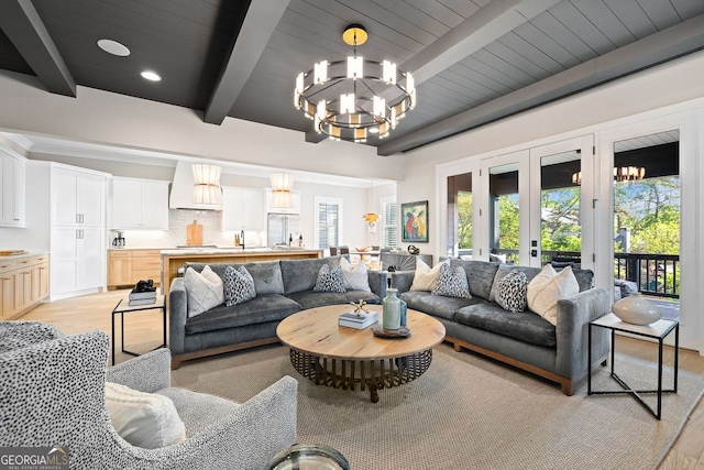 2587 Apple Valley Rd, Brookhaven, GA 30319 - living area featuring light wood finished floors, a chandelier, french doors, and a wooden ceiling with exposed beams