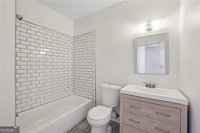 full bathroom featuring washtub / shower combination, toilet, and vanity