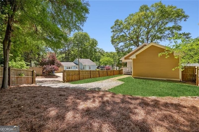 view of yard featuring a fenced backyard