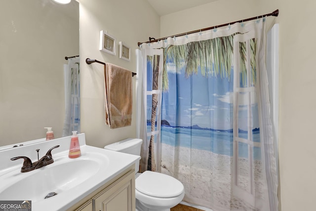 full bath with a shower with curtain, toilet, and vanity