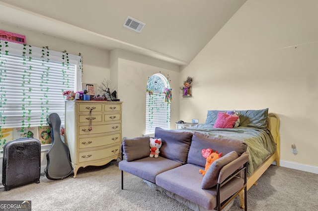 bedroom with baseboards, lofted ceiling, visible vents, and light colored carpet