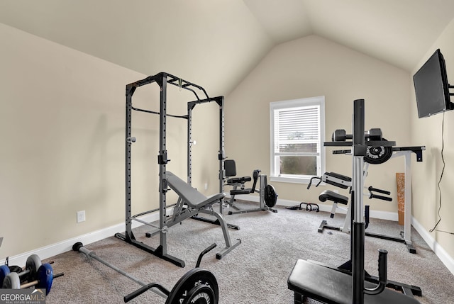 workout room with baseboards and lofted ceiling