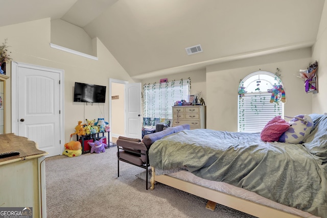 carpeted bedroom featuring high vaulted ceiling and visible vents