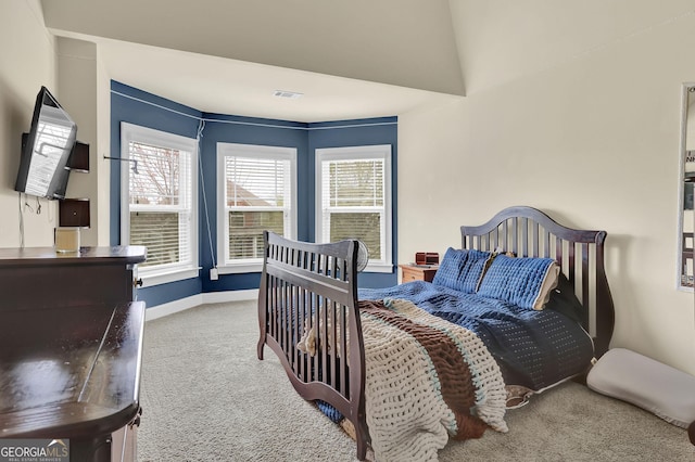 bedroom with carpet flooring, baseboards, and visible vents
