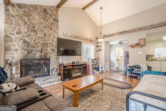 200 Villa Rd Unit 103, Jasper, GA 30143 - living room with wood finished floors, beam ceiling, baseboards, a fireplace, and high vaulted ceiling