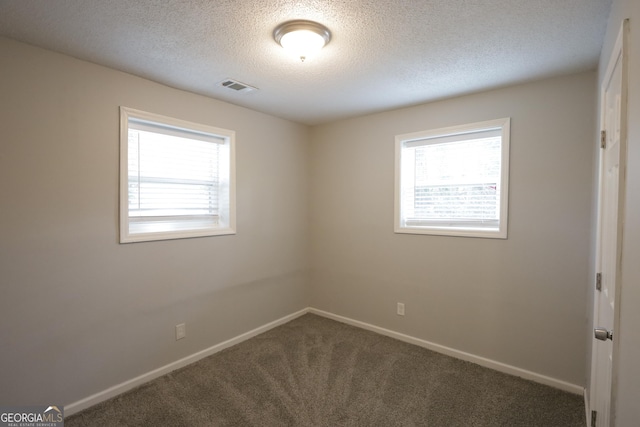 3363 Wesley Chapel Rd, Decatur, GA 30034 - carpeted empty room with baseboards, a healthy amount of sunlight, and visible vents