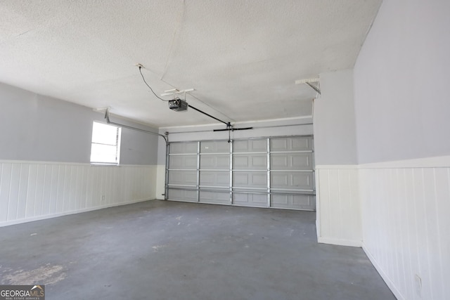 3363 Wesley Chapel Rd, Decatur, GA 30034 - garage with a wainscoted wall and a garage door opener