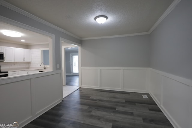 3363 Wesley Chapel Rd, Decatur, GA 30034 - interior space featuring a sink, crown molding, dark wood-type flooring, and a textured ceiling