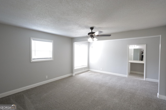 3363 Wesley Chapel Rd, Decatur, GA 30034 - carpeted empty room featuring baseboards, a textured ceiling, and ceiling fan