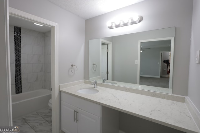 3363 Wesley Chapel Rd, Decatur, GA 30034 - full bath featuring vanity, toilet, a textured ceiling, marble finish floor, and ceiling fan