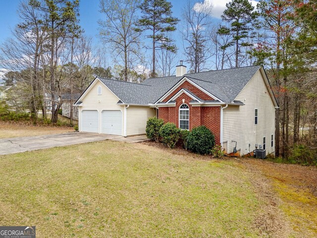 57 Sorghum Ct, Dallas, GA 30157 - view of front facade featuring concrete driveway, a chimney, a garage, roof with shingles, and a front yard