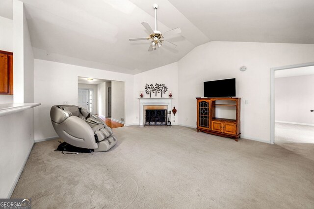 57 Sorghum Ct, Dallas, GA 30157 - living area with lofted ceiling, a ceiling fan, light carpet, a fireplace with flush hearth, and baseboards