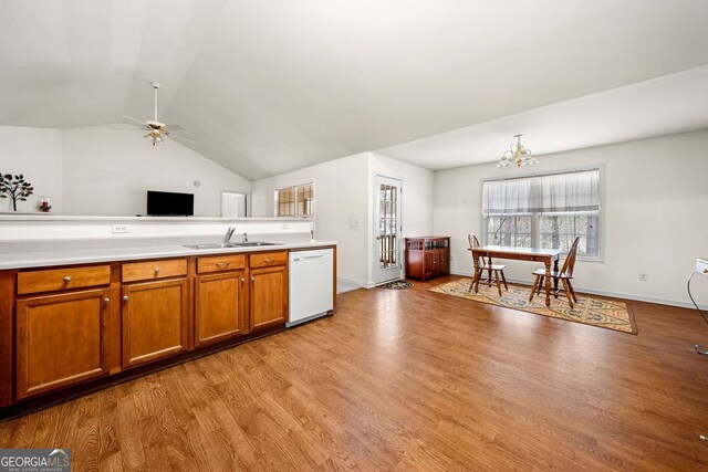 57 Sorghum Ct, Dallas, GA 30157 - kitchen with dishwasher, a sink, brown cabinetry, ceiling fan, and light countertops