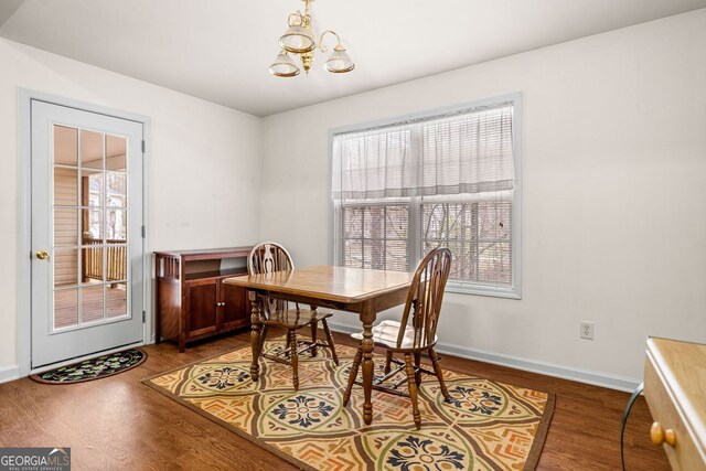 57 Sorghum Ct, Dallas, GA 30157 - dining room featuring a chandelier, wood finished floors, and baseboards