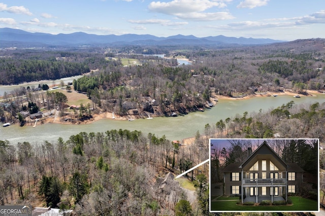 bird's eye view featuring a water and mountain view and a wooded view