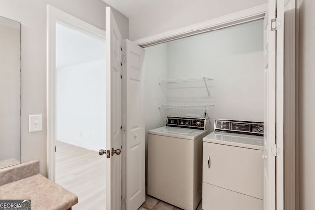 laundry room featuring washing machine and dryer and laundry area