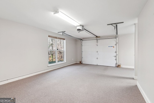 garage featuring baseboards and a garage door opener