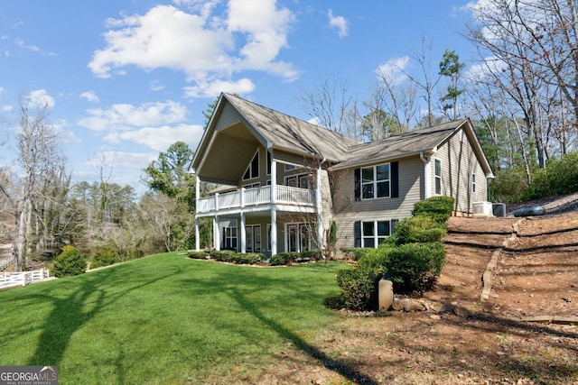 back of property featuring a lawn