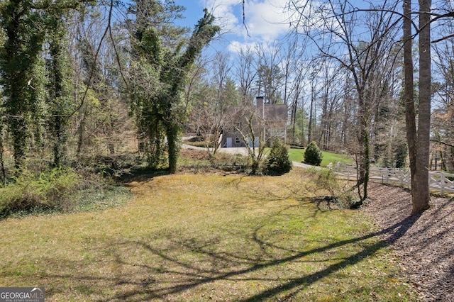 view of yard with a wooded view
