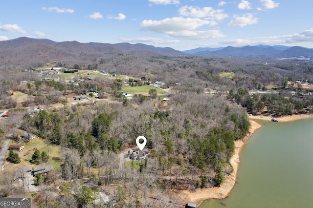 drone / aerial view featuring a water and mountain view