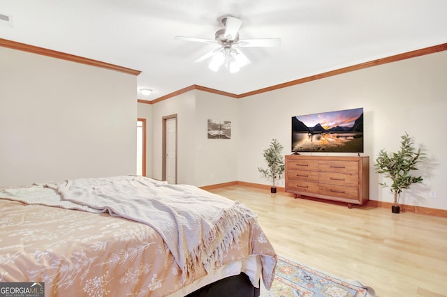 bedroom featuring visible vents, ceiling fan, baseboards, light wood-type flooring, and crown molding