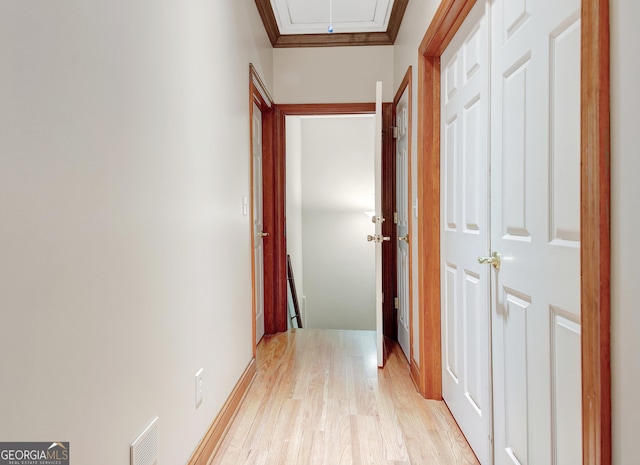 165 Hideaway Dr, Fayetteville, GA 30215 - hall with light wood-style flooring, ornamental molding, and attic access