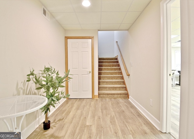 interior space with wood finished floors, visible vents, and baseboards