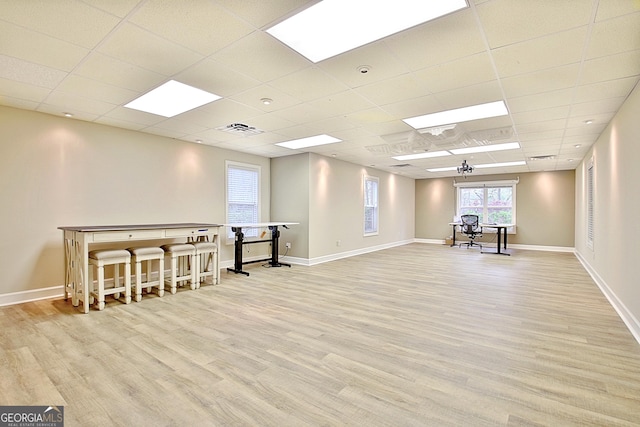 interior space featuring wood finished floors, visible vents, and baseboards
