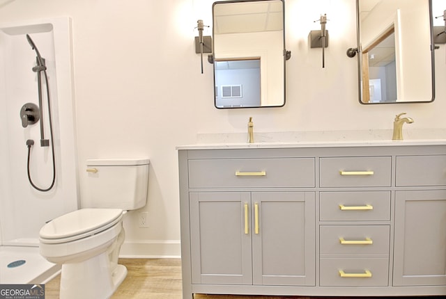 165 Hideaway Dr, Fayetteville, GA 30215 - bathroom with double vanity, wood finished floors, and a shower