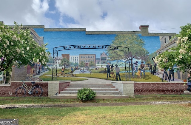 view of community featuring a lawn