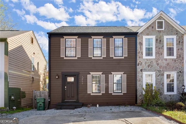 3859 Meadow Creek Dr, Peachtree Corners, GA 30092 - view of front facade with stone siding and a shingled roof