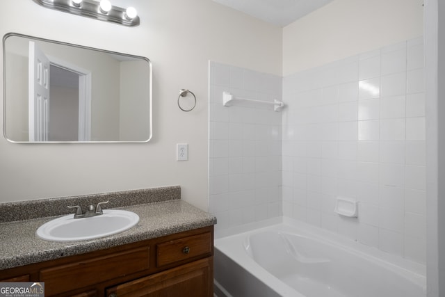 full bath featuring washtub / shower combination and vanity