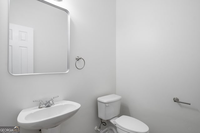 bathroom featuring a sink and toilet