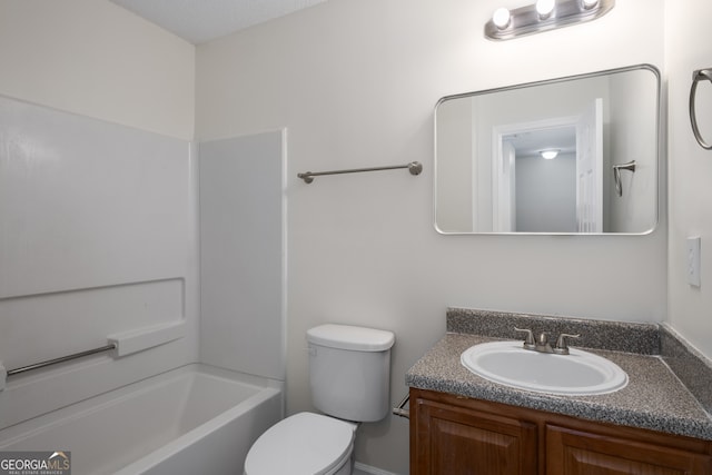 full bathroom with toilet, vanity, and washtub / shower combination