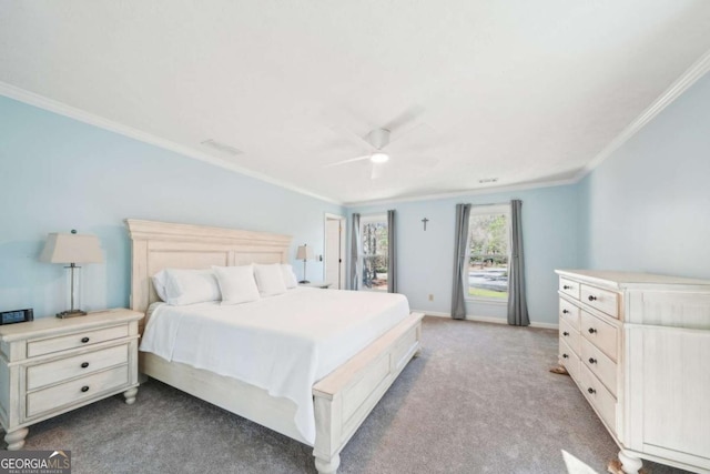carpeted bedroom with a ceiling fan, crown molding, and baseboards