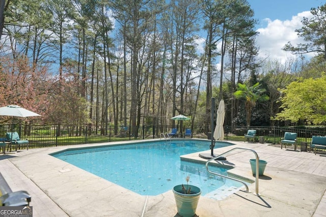 view of swimming pool with fence, a patio, and a fenced in pool