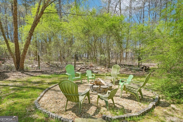 view of yard with a fire pit
