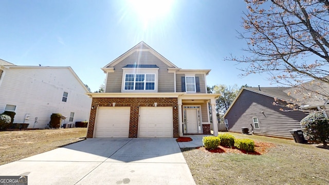 view of front facade with driveway, an attached garage, and brick siding