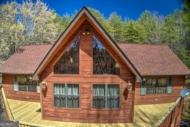 view of home's exterior featuring a shingled roof